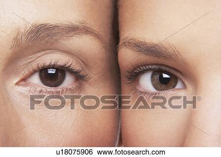 Stock Photograph - Two women's eyes, side by side. Fotosearch