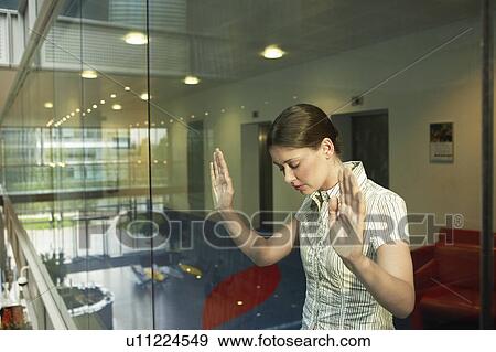 Woman Behind Glass Wall in office View Large Photo Image Stock Photo - Woman Behind Glass Wall in office. Fotosearch