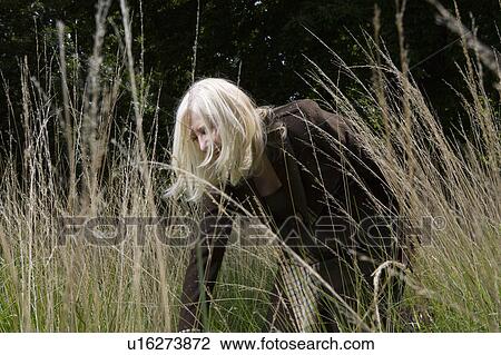 Stock Image - Woman in a Meadow. Fotosearch