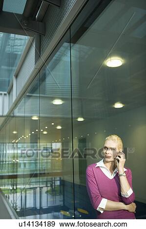 Woman in Office on Cell Phone View Large Photo Image Stock Photo - Woman in Office on Cell Phone. Fotosearch