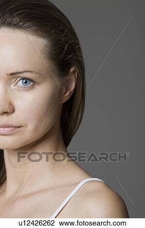 Woman Looking At Camera, Studio Shot, Cropped View Large Photo Image Stock Image - Woman Looking At Camera, Studio Shot, Cropped. Fotosearch