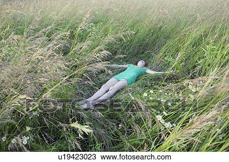 Woman Lying in Tall Grass View Large Photo Image Stock Image - Woman Lying in Tall Grass. Fotosearch