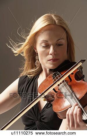 Stock Photography - Woman Playing Violin, close up. Fotosearch