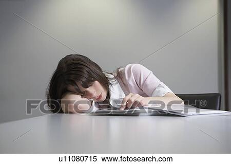 Woman sleeping at desk View Large Photo Image Stock Photography - Woman sleeping at desk. Fotosearch