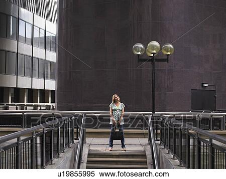 Woman standing at top of steps View Large Photo Image Stock Photography - Woman standing at top of steps. Fotosearch