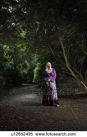 Woman Standing on a Path in the Woods View Large Photo Image Stock Photography - Woman Standing on a Path in the Woods. Fotosearch