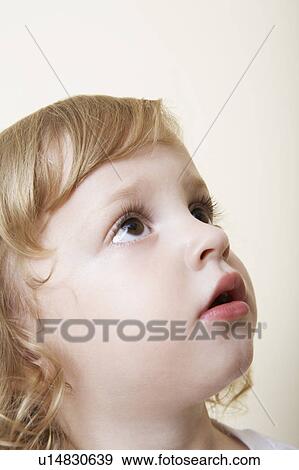 Young child looking up View Large Photo Image Stock Photo - Young child looking up. Fotosearch