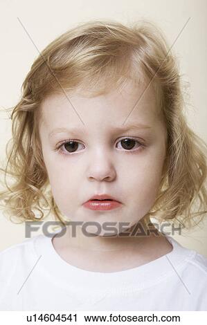 Stock Image - Young child sulking. Fotosearch