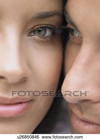 Stock Photograph - Young Couple Cheek to Cheek. Fotosearch
