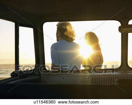 Young couple on Beach, view through camper van View Large Photo Image Stock Image - Young couple on Beach, view through camper van. Fotosearch