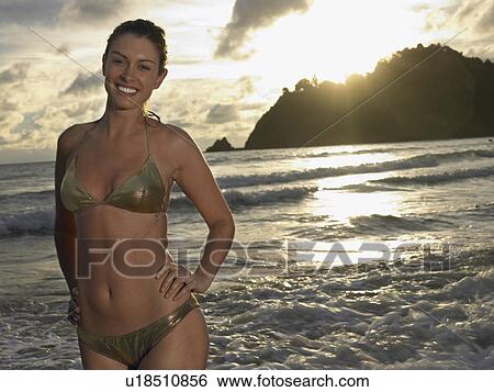 Young Woman at Beach at Sunset View Large Photo Image Stock Photograph - Young Woman at Beach at Sunset. Fotosearch
