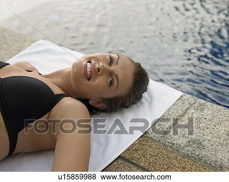 Young Woman in Bikini by Swimming Pool View Large Photo Image Stock Photo - Young Woman in Bikini by Swimming Pool. Fotosearch