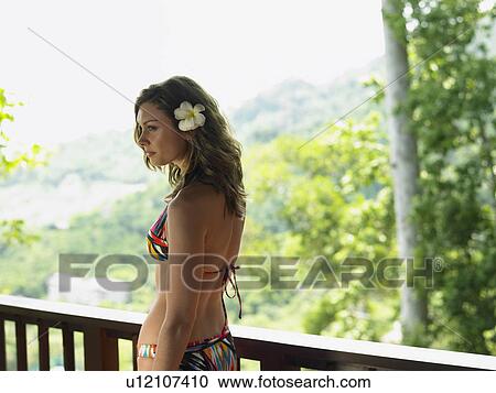 Young Woman in Bikini with Flower in Hair View Large Photo Image Stock Image - Young Woman in Bikini with Flower in Hair. Fotosearch