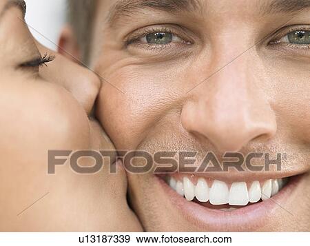 Young Woman Kissing Man's Cheek View Large Photo Image Stock Photo - Young Woman Kissing Man's Cheek. Fotosearch