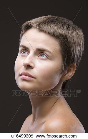 Young woman looking up View Large Photo Image Stock Photography - Young woman looking up. Fotosearch