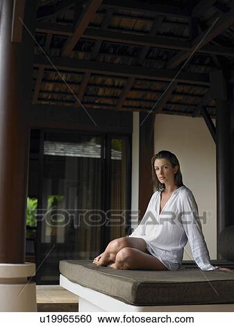 Stock Image - Young Woman on Daybed. Fotosearch