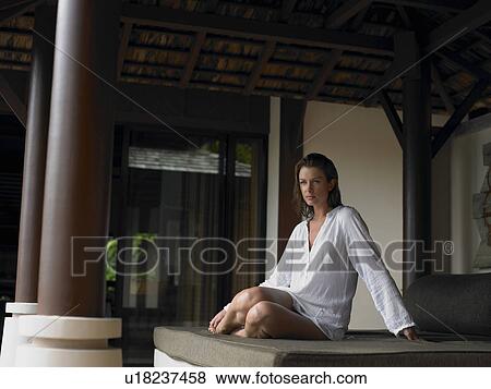 Stock Photo - Young Woman on Daybed. Fotosearch