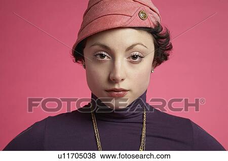 Stock Photo - Young woman on pink background, portrait, close-up. Fotosearch