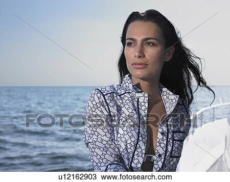Young woman on yacht View Large Photo Image Stock Image - Young woman on yacht. Fotosearch