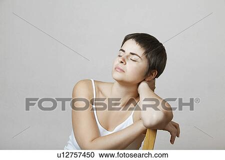 Young Woman Sitting in Chair View Large Photo Image Stock Image - Young Woman Sitting in Chair. Fotosearch