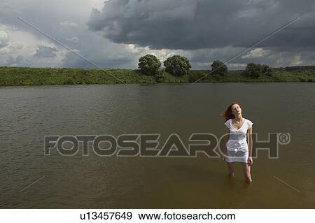Young Woman Standing in River View Large Photo Image Stock Photo - Young Woman Standing in River. Fotosearch