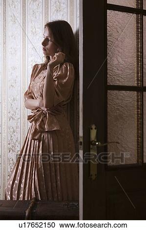 Young woman stands in shadow of doorway in Russian apartment View Large Photo Image Stock Image - Young woman stands in shadow of doorway in Russian apartment. Fotosearch