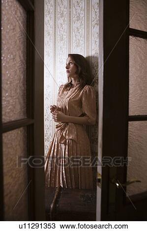 Young woman through glass panelled doors of Russian apartment View Large Photo Image Stock Image - Young woman through glass panelled doors of Russian apartment. Fotosearch