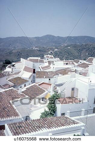 Aerial view of tiled roofs in white Spanish village View Large Photo Image Stock Photo - Aerial view of tiled roofs in white Spanish village. Fotosearch