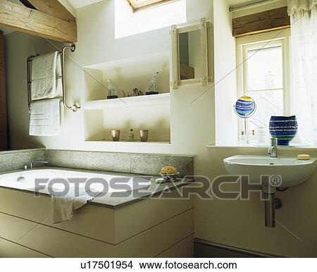 Alcove shelving above bath in modern white country bathroom View Large Photo Image Picture - Alcove shelving above bath in modern white country bathroom. Fotosearch