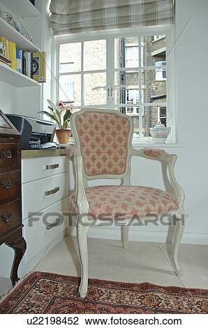 Armchair in front of window in corner of study living room View Large Photo Image Stock Image - Armchair in front of window in corner of study living room. Fotosearch