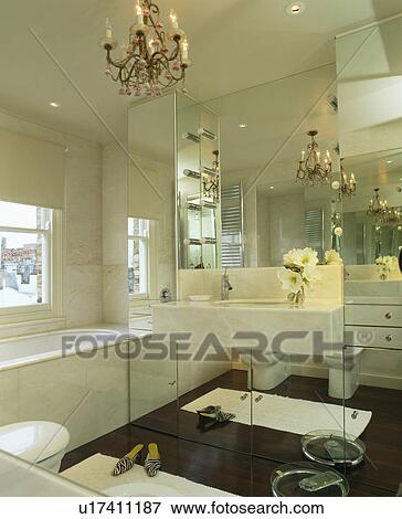 Basin and mirrored wall in modern white bathroom View Large Photo Image Stock Photo - Basin and mirrored wall in modern white bathroom. Fotosearch