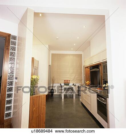 Picture - Beige linen blind in modern kitchen dining room with dark grey flooring. Fotosearch