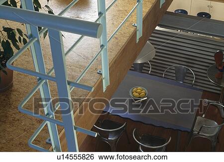 Birdseye view of metal table in modern dining room View Large Photo Image Stock Photograph - Birdseye view of metal table in modern dining room. Fotosearch