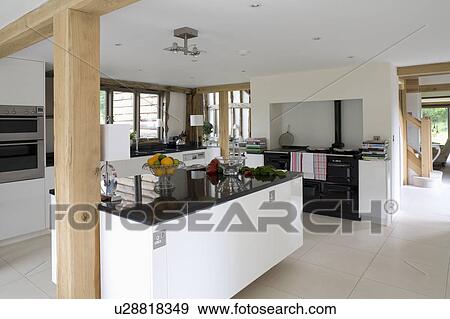 Black Granite Worktop On Island Unit In Modern White Barn