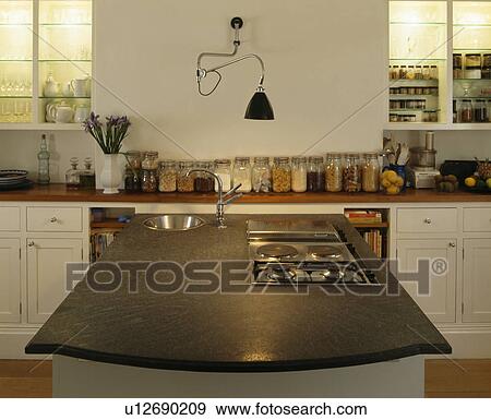 Black worktop on island unit in modern white kitchen View Large Photo Image Stock Photo - Black worktop on island unit in modern white kitchen. Fotosearch