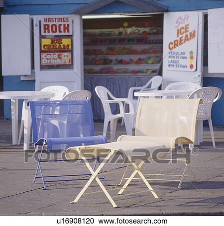 Blue and cream metal chairs and table in front of ice-cream booth View Large Photo Image Stock Image - Blue and cream metal chairs and table in front of ice-cream booth. Fotosearch