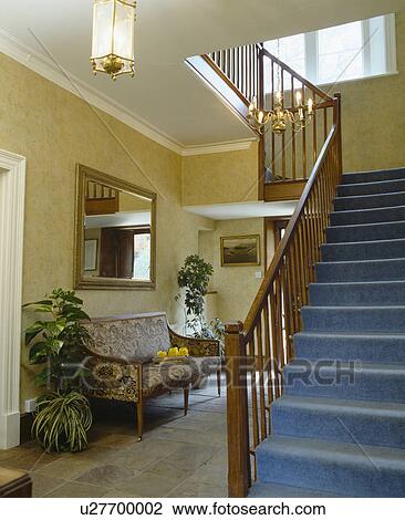 Blue carpet on staircase in traditional cream hall View Large Photo Image Stock Image - Blue carpet on staircase in traditional cream hall. Fotosearch