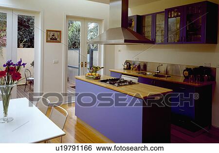 Blue island unit with wooden worktop in modern kitchen dining room View Large Photo Image Stock Photograph - Blue island unit with wooden worktop in modern kitchen dining room. Fotosearch