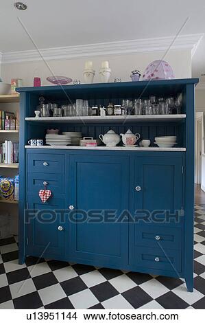 Blue kitchen dresser with marble shelves and concealed fridge View Large Photo Image Picture - Blue kitchen dresser with marble shelves and concealed fridge. Fotosearch
