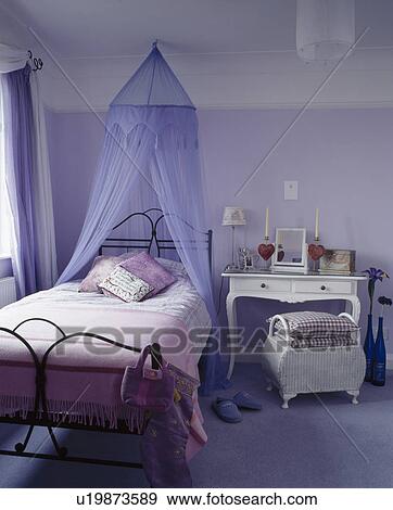 Blue voile tent above metal bed in blue teenage bedroom View Large Photo Image Stock Photo - Blue voile tent above metal bed in blue teenage bedroom. Fotosearch