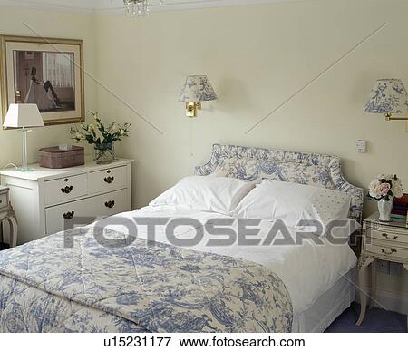 Blue+white Toile-de-Jouy quilt and headboard on bed with white linen View Large Photo Image Stock Photo - Blue+white Toile-de-Jouy quilt and headboard on bed with white linen. Fotosearch