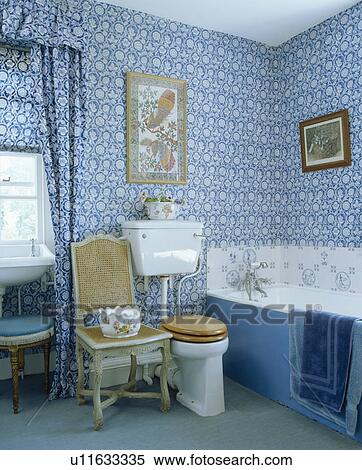 Blue+white wallpaper and matching curtains in traditional bathroom View Large Photo Image Stock Photography - Blue+white wallpaper and matching curtains in traditional bathroom. Fotosearch