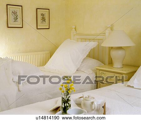 Breakfast tray on bed with white linen in cream country bedroom View Large Photo Image Stock Image - Breakfast tray on bed with white linen in cream country bedroom. Fotosearch