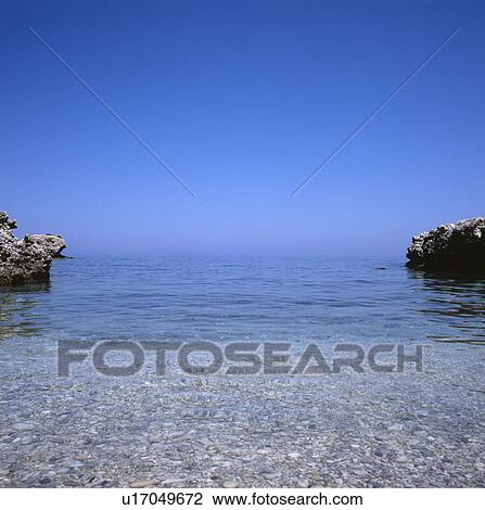 Bright blue sky above sea in small bay in Kefalonia island in Greece View Large Photo Image Stock Image - Bright blue sky above sea in small bay in Kefalonia island in Greece. Fotosearch