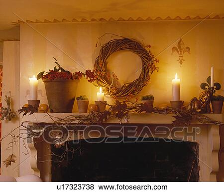 Candles and wreath on mantelpiece decorated for Christmas View Large Photo Image Stock Photo - Candles and wreath on mantelpiece decorated for Christmas. Fotosearch