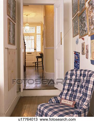 Checked armchair in small traditional hall View Large Photo Image Stock Image - Checked armchair in small traditional hall. Fotosearch