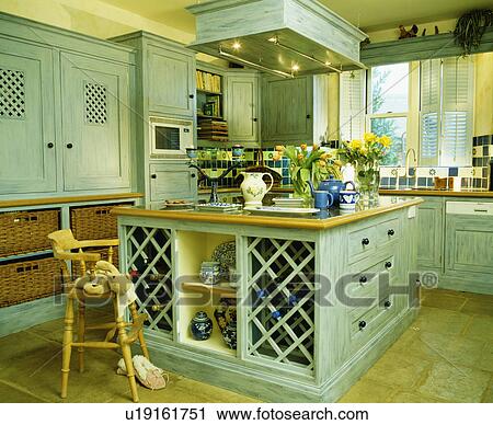 Child's wooden high-chair beside large pastel turquoise island unit View Large Photo Image Stock Image - Child's wooden high-chair beside large pastel turquoise island unit. Fotosearch