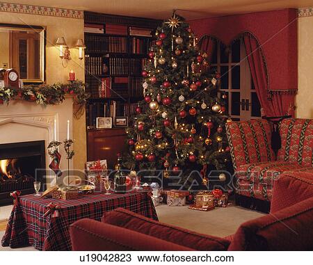 Christmas tree in traditional living room View Large Photo Image Stock Image - Christmas tree in traditional living room. Fotosearch