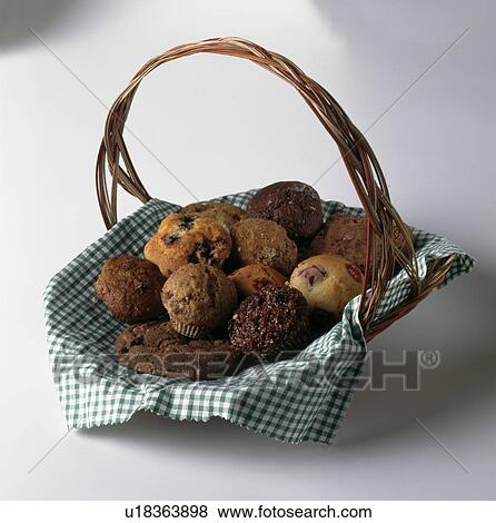 Close-up of a basket of home-made muffins View Large Photo Image Stock Photo - Close-up of a basket of home-made muffins. Fotosearch