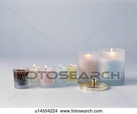 Close-up of a collection of glass and terracotta and silver candle holders View Large Photo Image Picture - Close-up of a collection of glass and terracotta and silver candle holders. Fotosearch